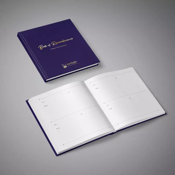 Photo of the LauraLynn Book of Remembrance. Navy book hardback book with gold foil font on front.