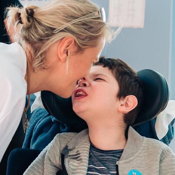 Daniel sharing a kiss with his mum during an event at LauraLynn 