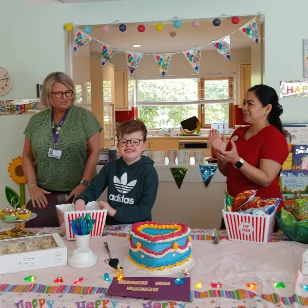 Cian cutting the LauraLynn 13th Birthday cake 
