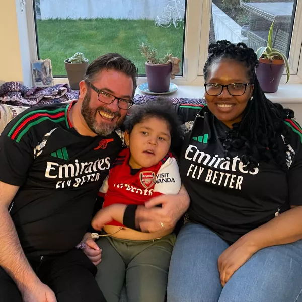 Cillian, our Summer Raffle Superhero with his Mum and Dad