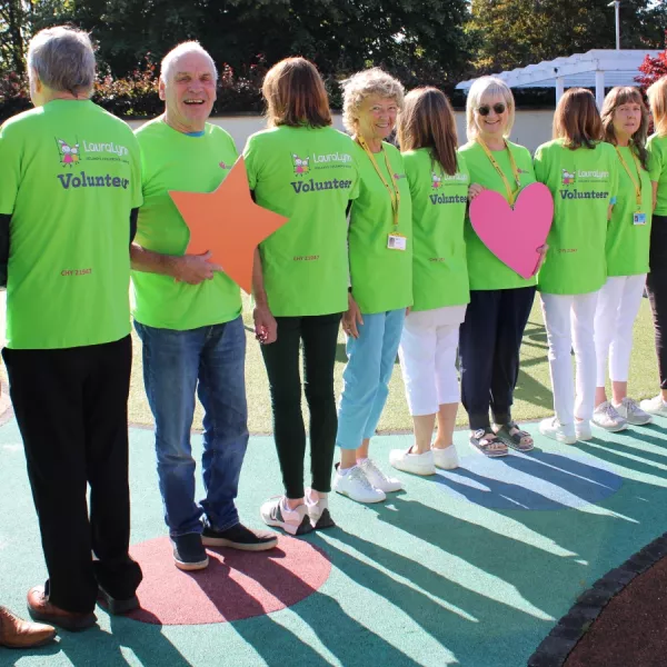 Volunteers wearing green t-shirts