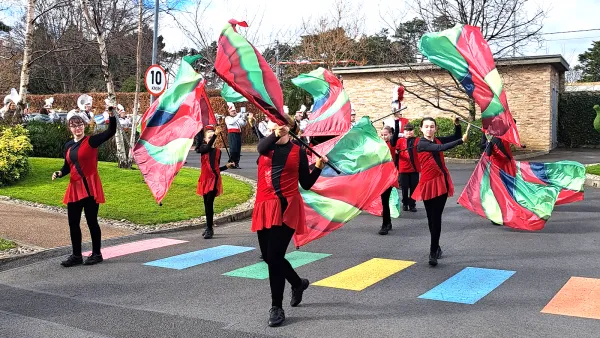 Vibrant color guard flags add a splash of colour to LauraLynn’s St. Patrick’s Day Parade.