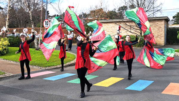 Vibrant color guard flags add a splash of colour to LauraLynn’s St. Patrick’s Day Parade.