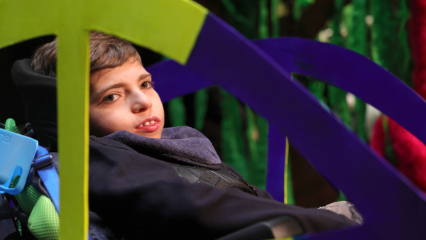 Harry Hoare takes a joyful ride in his cardboard car on the Abbey Theatre stage