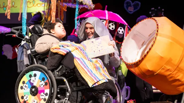 Cillian on stage with Gerry the Elephant and the magic cement mixer