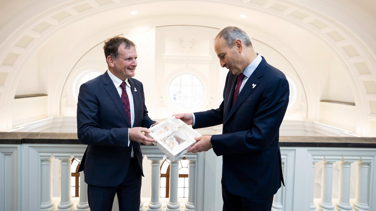 Chairperson of LauraLynn Children’s Hospice Niall McHugh (left) is pictured presenting a gift hand made in the hospice to Taoiseach Micheál Martin 