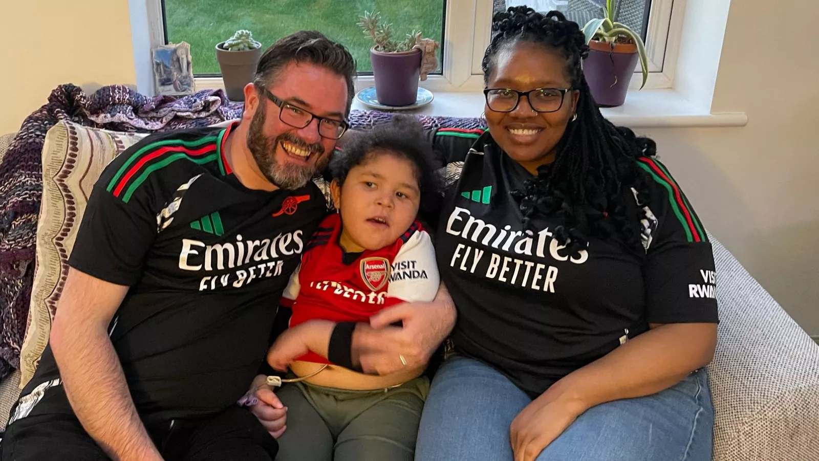 Cillian, our Summer Raffle Superhero with his Mum and Dad