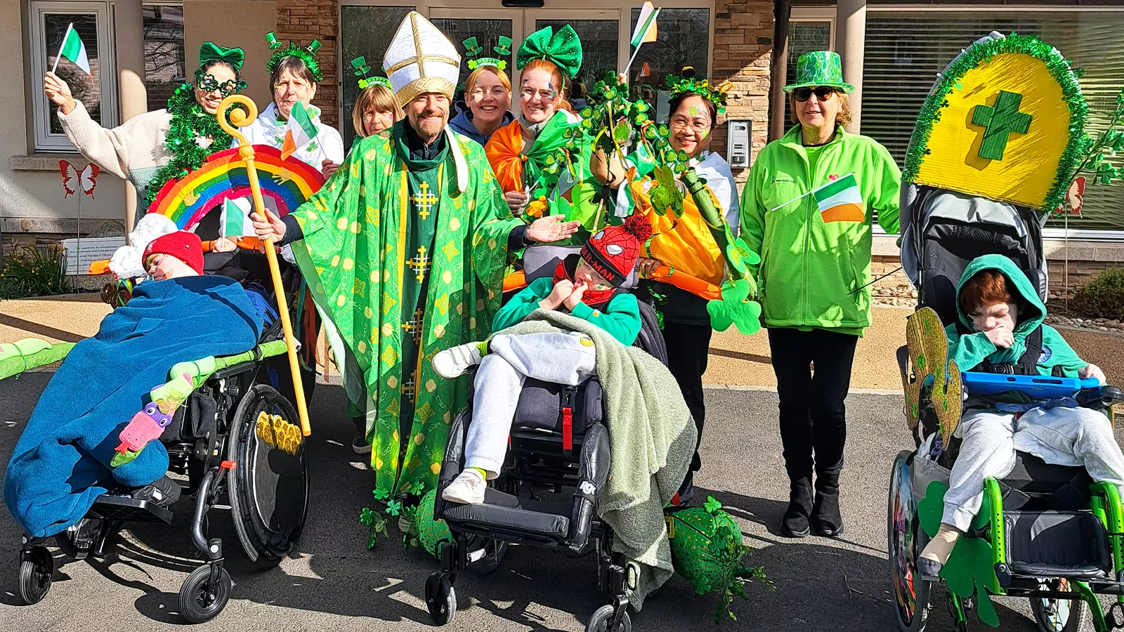 Alan Hughes dressed as St. Patrick, joins LauraLynn children and staff