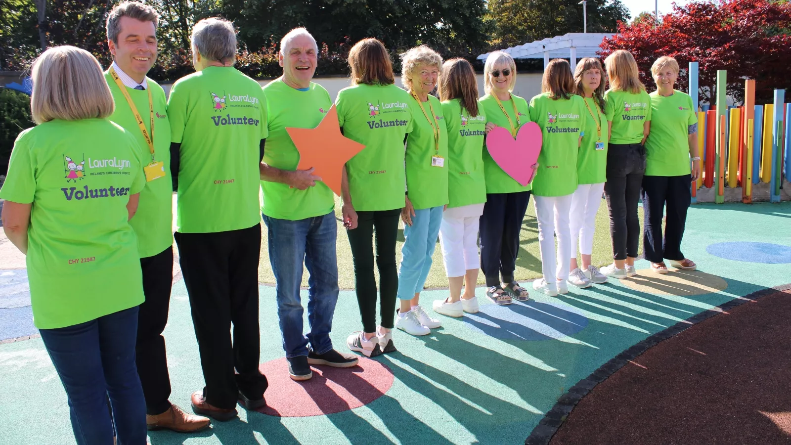 Volunteers wearing green t-shirts